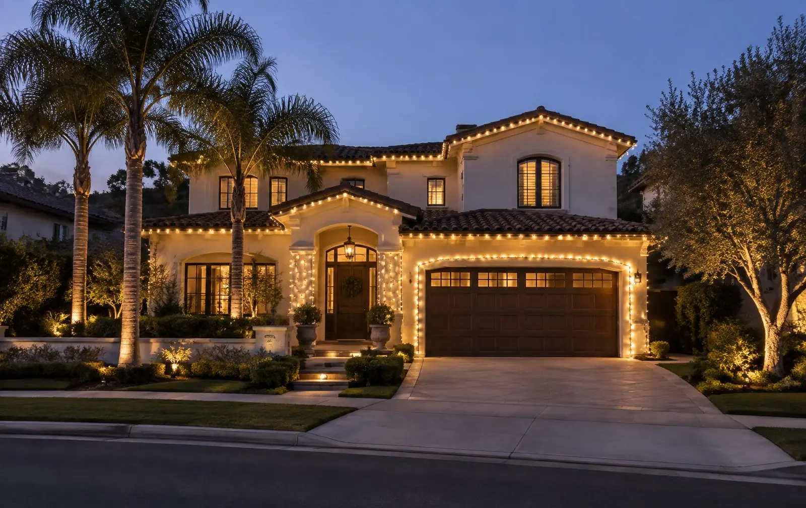 Home in Murrieta, CA with warm white Christmas lights outlining the roofline at dusk